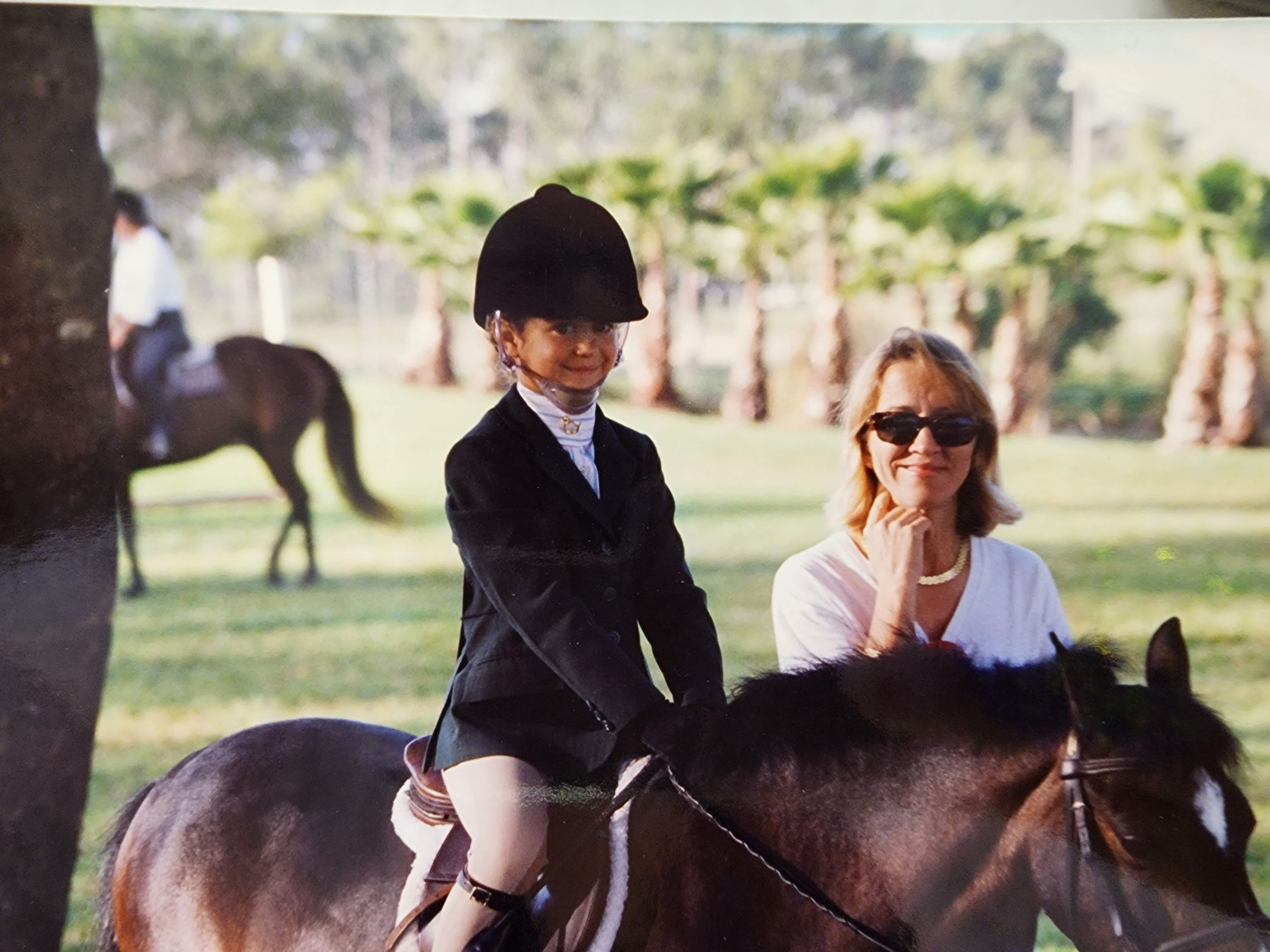 Little Girl Riding a Horse