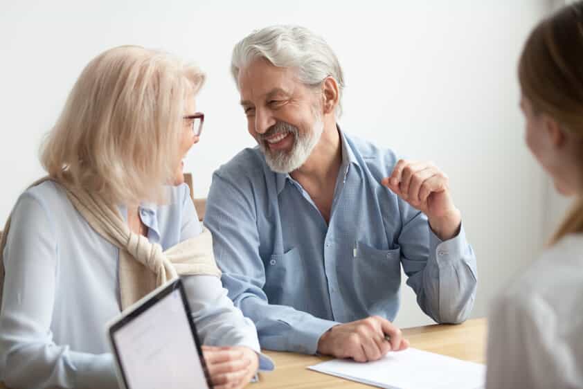 Elderly Couple Smiling at Eachother